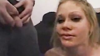 Two guys peeing on a blonde slut