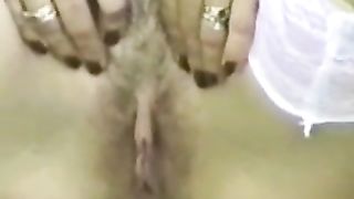 Hairy woman peeing in close up