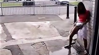 Asian girl peeing in the streets