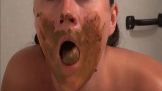 Brunette woman swallows fresh shit