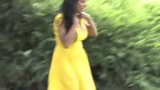 Brunette milf in yellow dress peeing