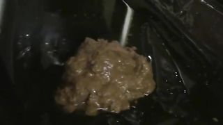 Brunette teen rubbing poop on her naked body