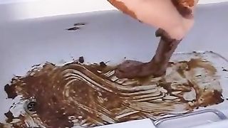 Beautiful blonde smears poop on her tits