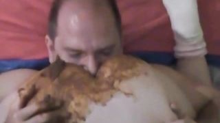 Mature couple eating poop together