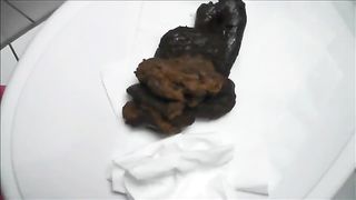 Pierced girl pooping in toilet