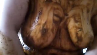 Fat woman smears poop on her tits