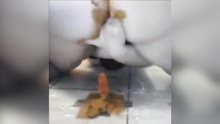 Fat girl shitting on a red dildo