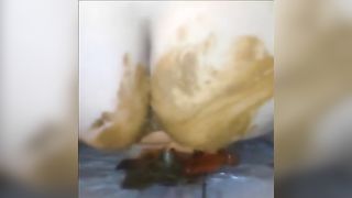 Fat girl shitting on a red dildo