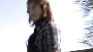 British babe peeing on a wooden fence