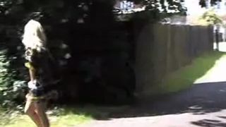 Cute blonde babe peeing near foothpath
