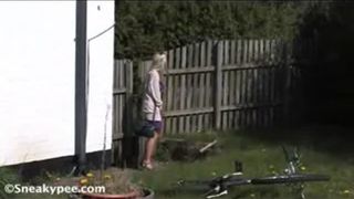 Blonde teacher peeing in school yard