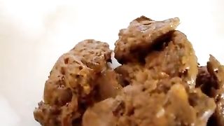 Blonde girl shitting on a plate