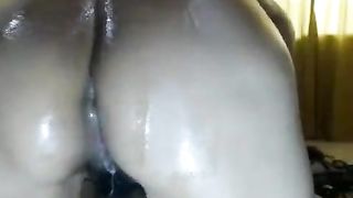 Hairy babe shitting on a dildo
