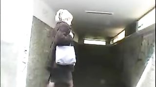 Blonde European babe peeing in underpass