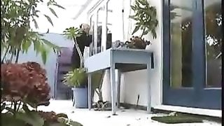 European blonde girl peeing on door steps