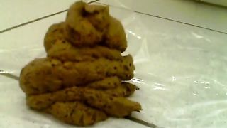 Spreading butt cheeks while pooping slowly