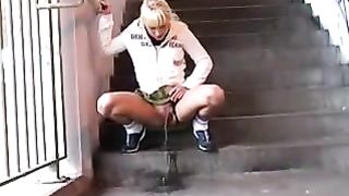 Blonde milf peeing in public place