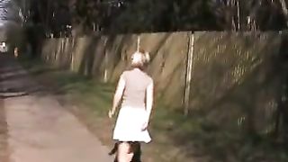 Chick with white skirt peeing in public