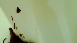 Fat pierced girl shitting in bathtub