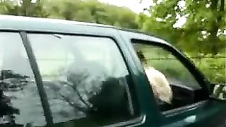 Blonde babe peeing from moving car