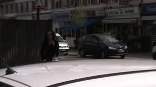 Sexy girl peeing behind parked car