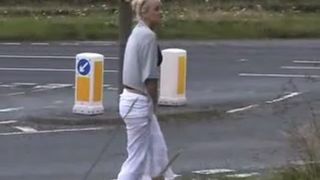 Blonde teen peeing near highway