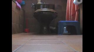 Dark haired teen shitting