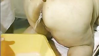 Fat granny shitting after enema