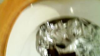 Spreading butt cheeks to poop in toilet