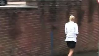 Blonde girl peeing outdoor