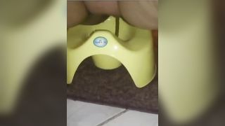 Fat wife shitting in green potty