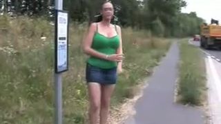Busty brunette peeing in bus stop