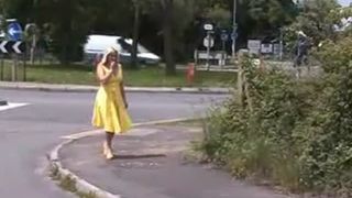 Wearing a yellow dress while peeing