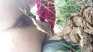 Shaved milf shitting outdoor