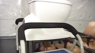 Two guys shitting on a female slave