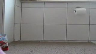 Pierced girl shitting on a plate