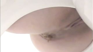 Amateur babe shitting on homemade toilet