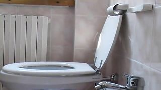 Hairy wife shitting over toilet