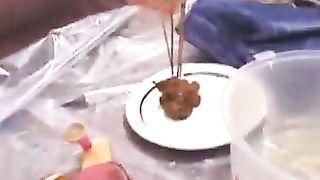 Redhead girl shitting on white plate