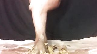 Smearing yellow shit on her feet