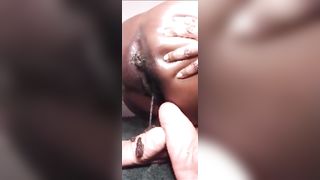 Ebony girl shitting on her feet slowly