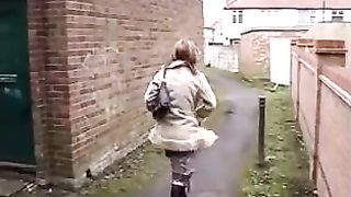 Pierced babe peeing outdoor