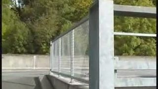 Redhead teen peeing on a bridge