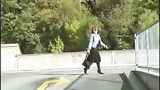 Redhead teen peeing on a bridge