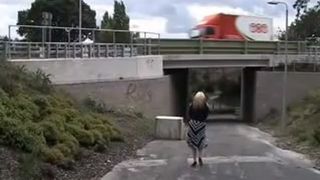 Busty blonde babe peeing outdoor