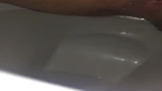 Shaved girl pooping slowly