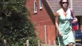 Two girls peeing behind a tree