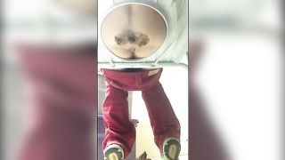 Shitting on a white homemade toilet