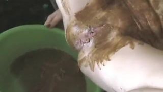 Granny smears shit on her pussy slowly