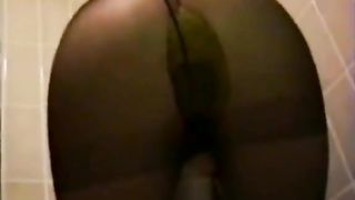Asian mature woman shitting in black pantyhose